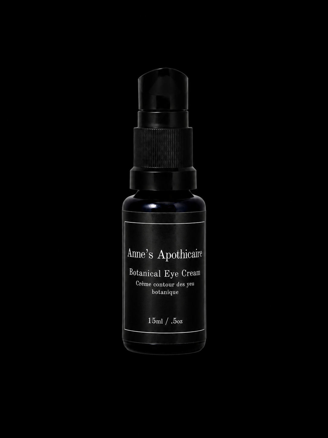 A black glass dropper bottle of Anne's Apothicaire Botanical Eye Cream, centered against a solid black background.