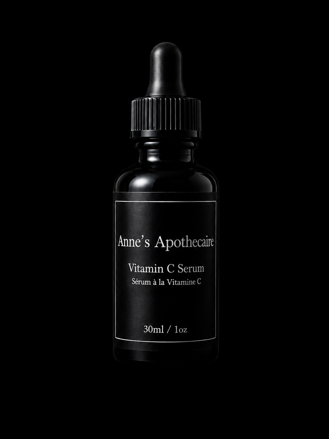 Black bottle of Anne's Apothecaire Vitamin C Serum on a black background